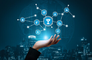 A hand reaching towards a virtual network of icons symbolizing achievement and connection against a modern urban backdrop, showcasing technological progress and innovation. Tessel