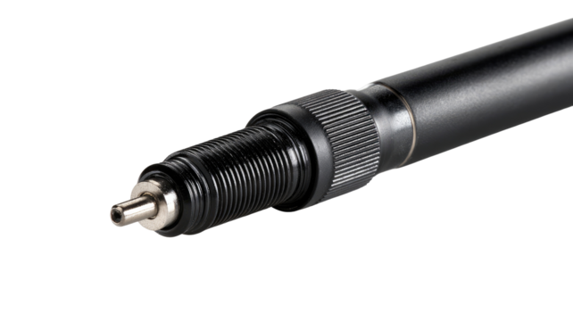 Close-up of a black engine spark plug.  The threaded portion and tip are visible.  A knurled ring is around the threads