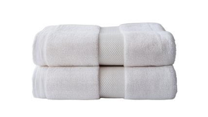 Soft plush white towels neatly folded for spa or hotel luxury