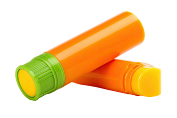 Two orange and lime-green tubes, likely lip balm or similar, overlapping, angled slightly, on a plain background