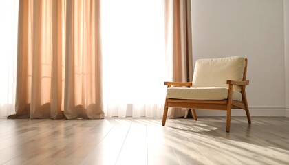 Sunlight streams into a room with a beige chair