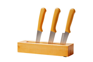 Three knives with yellow handles in a wooden block