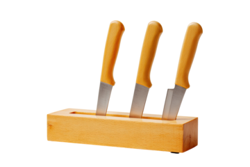 Three knives with yellow handles in a wooden block