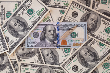 One hundred US dollar bills background