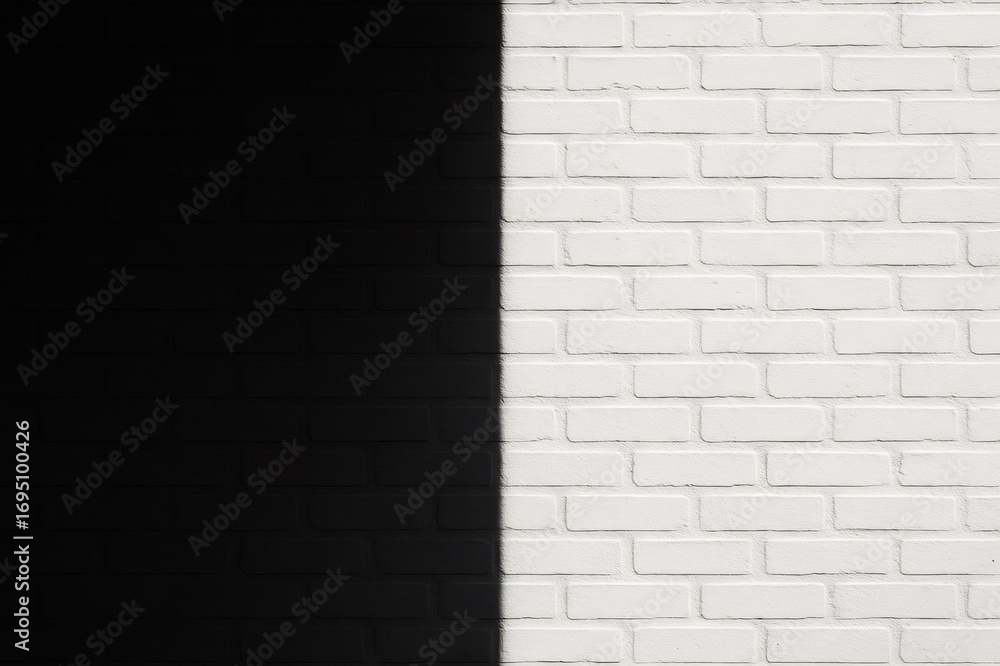 Poster dark shadow slicing through a white painted brick wall background, creating a striking high contrast