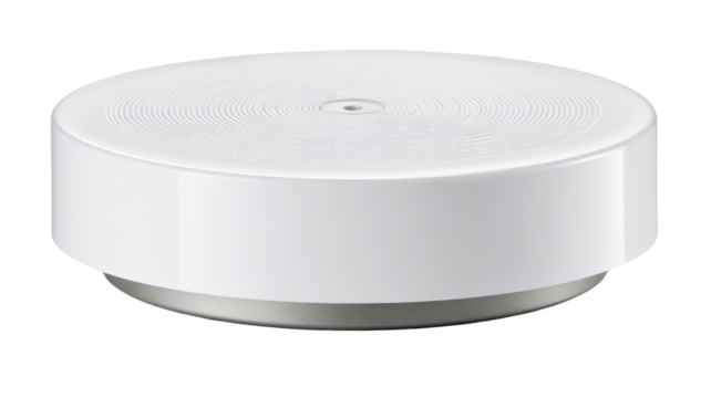 White smart home device spinning on table, indoor