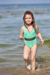 Young girl enjoying summer at the beach