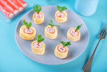 Omelette egg roll with imitation crab meat filling, tamagoyaki, in a plate