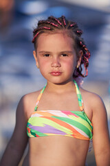 Girl in colorful swimsuit enjoying a sunny day