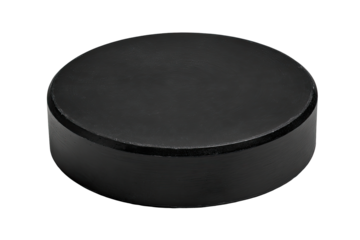 Black hockey puck isolated on black background, studio shot, for sports product