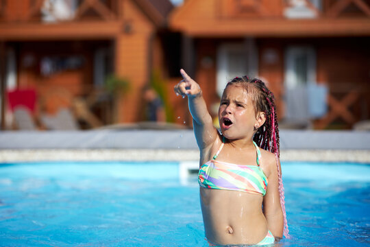 Girl enjoys summer fun in the pool
