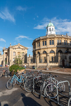 Oxford England UK. 31.08.2025. Cycle park on Broad Street Oxford with background of the Radcliffe Camera building.