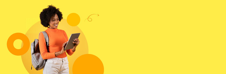 A student stands with a tablet, focused on her studies in a bright, modern educational setting. The background features a cheerful yellow color scheme that enhances the learning atmosphere.