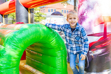 Happy kid on bouncy attraction