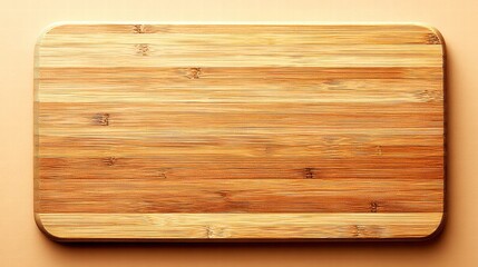 Obraz premium This top-down shot showcases a rectangular bamboo cutting board, perfect for culinary projects.