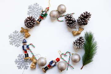 Festive Christmas wreath with nutcrackers, pine cones, and golden ornaments