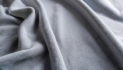Fototapeta premium Closeup Of Light Gray Fleece Fabric With Soft Matte Texture In Daylight For Textile Design Background Or Cozy Winter Product Mockup