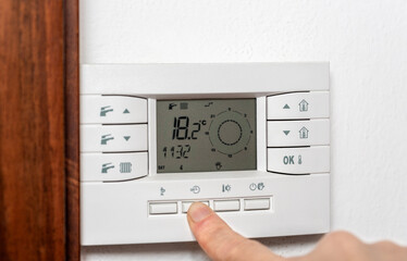 Press the timer button on the digital thermostat to set the microclimate control settings in your home and increase the temperature.