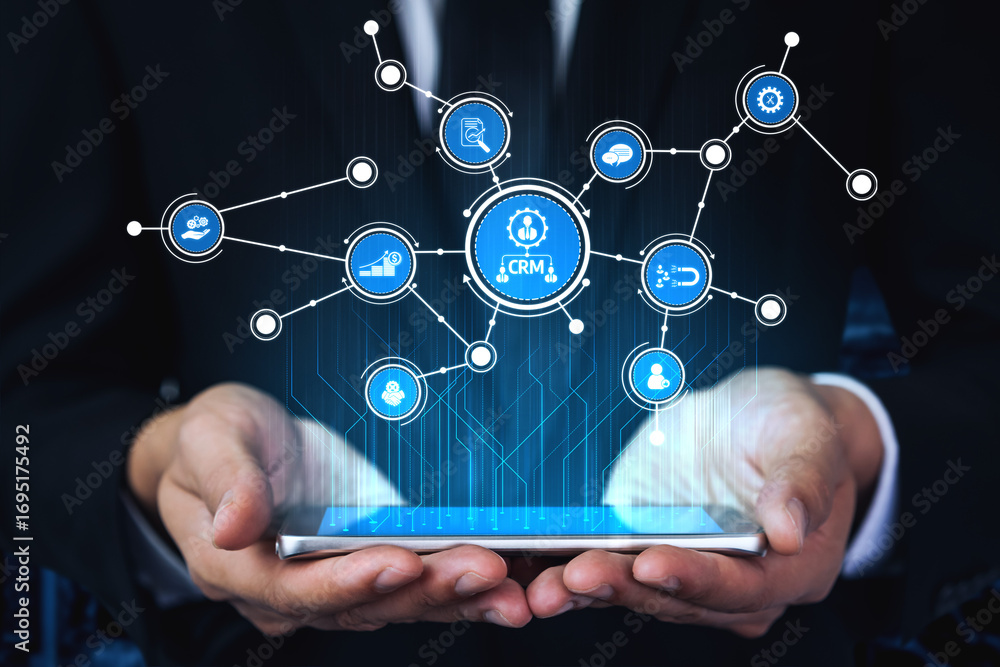 Aufkleber a businessman holds a smartphone displaying icons representing crm and digital connectivity in a mod