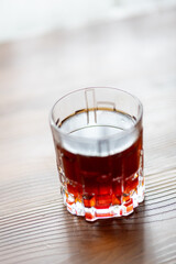 Pouring Filter Coffee into a Crystal Glass in Close-Up
