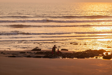 Picturesque sunset view of Cox’s Bazar beach with glowing sky and tranquil sea waves.