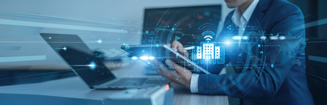 Energy efficiency, IoT automation Businessman using tab with analysis data of growth to smart building global connection, security systems, building management, smart sensors