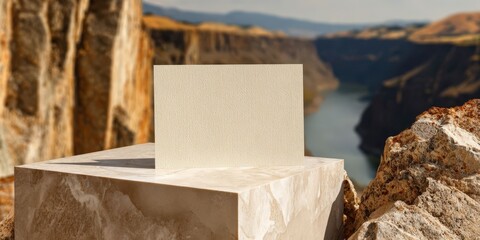 Beige Letterpress Card Mockup on Marble Block with Canyon Background