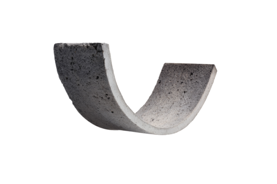 Curved, gray concrete gutter section, isolated on black