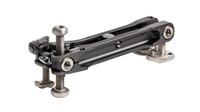 Black, metallic mechanical linkage.  Bolts, joints, and plates.  Precise engineering