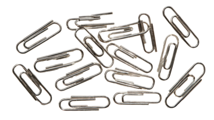 Scattered metal paperclips, a cluster of many, overlapping