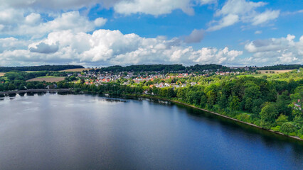 Aerial drone view of a huge stone dam on the lake Monetalsperre - Spermauer, Germany