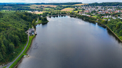 Aerial drone view of a huge stone dam on the lake Monetalsperre - Spermauer, Germany