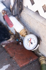 water pump on the side of a house
