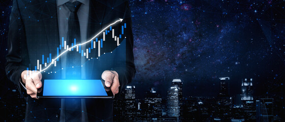 A businessman holds a tablet featuring a financial graph against a backdrop of a modern city skyline at night, enhanced by a starry sky. Impute