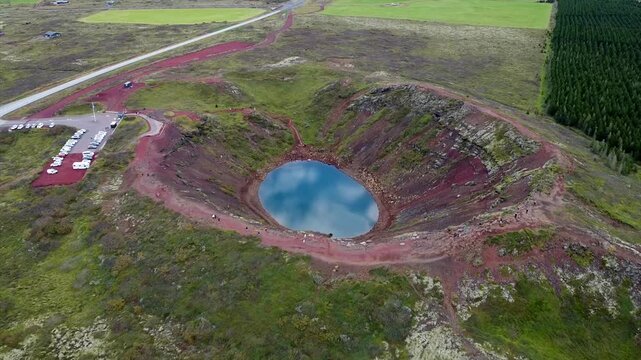 Drone Overview of Kerid Crater With Parking Lot and Tourists on Path
