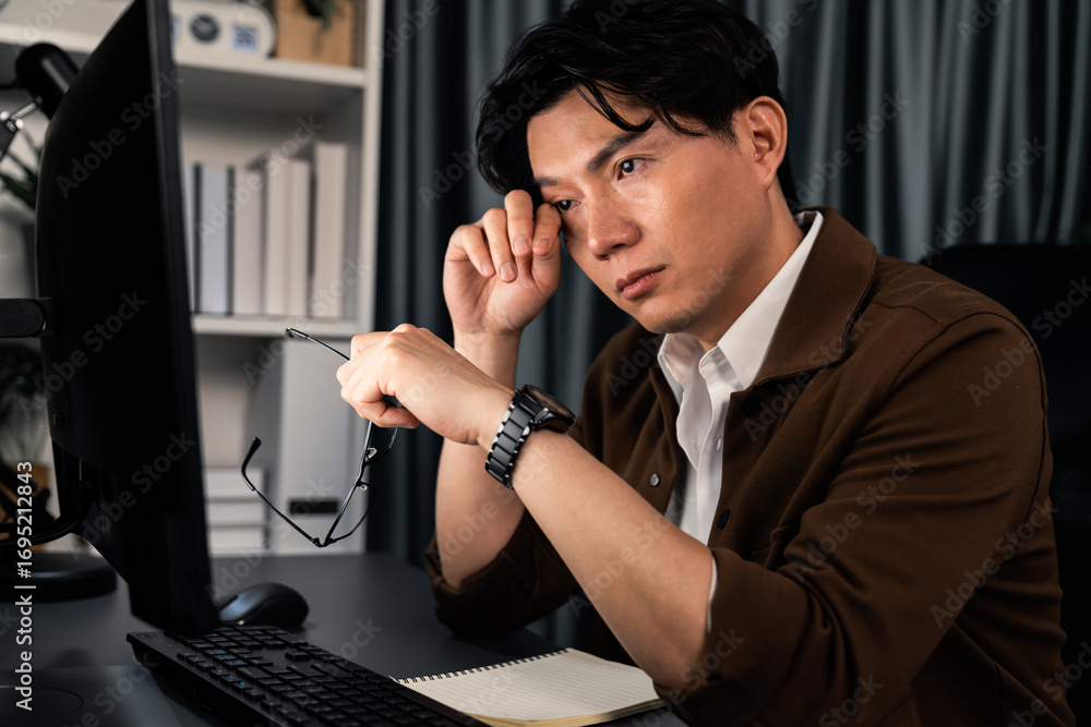 Poster working businessman feeling extremely tired with sleepy while working on desk with unfinish project 