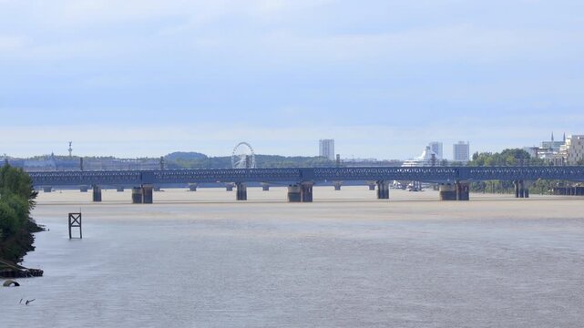 Eiffel footbridge and Saint-Jean bridge over the Garonne River in Bordeaux, France