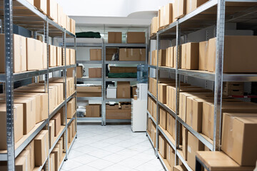 Industrial warehouse unit empty filled with boxes of goods and merchandise destined for...