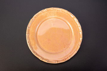 Beautiful plate, beautiful plate alone placed on a dark background, selective focus.