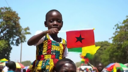 joyful child waving flag of guinea-bissau sits on adult's shoulders during vibrant parade. national pride and community celebration. travel, cultural event, independence day