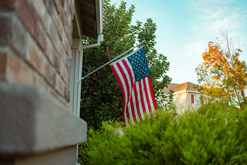 American Flag on a Suburban Home at Sunset