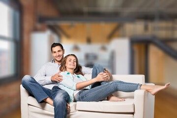 Fototapeta premium Portrait of young happy couple in living room