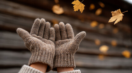 Autumn joy: wool gloves tossing golden leaves in rustic setting