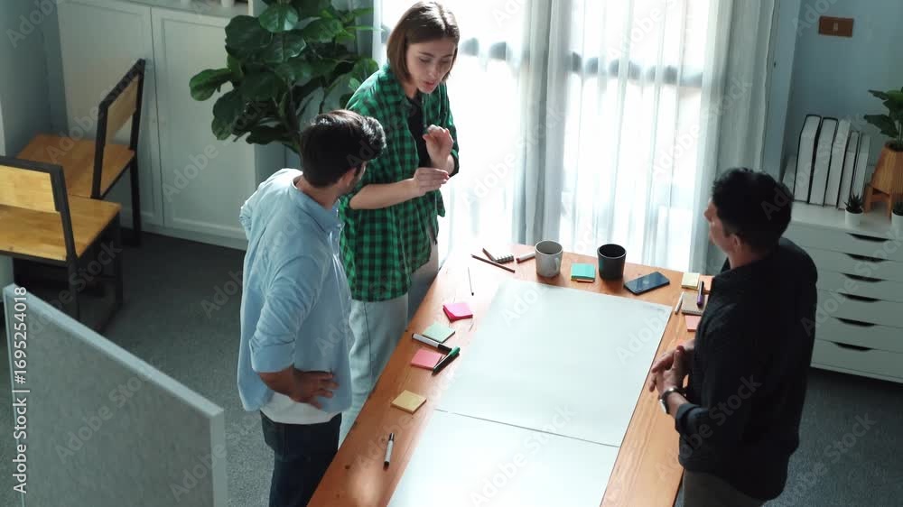 Poster top view of smart business team explain and discuss about plan at meeting table with sticky notes. g