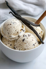 Fototapeta premium Vanilla ice cream dessert in a bowl with delicious scoops and flavor of gourmet treat