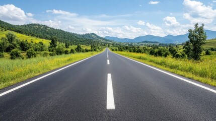 Fototapeta premium Scenic Open Road Surrounded by Lush Greenery and Majestic Mountains