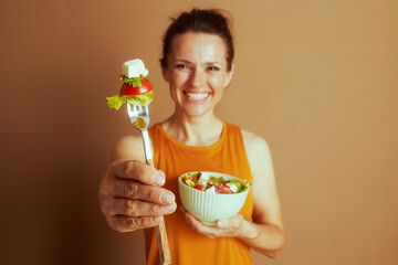 Woman with Mint Green Salad Bowl and Fork