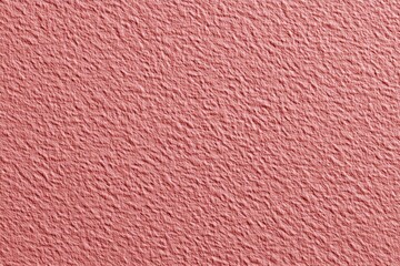 Textured pink paper surface with subtle creases and rough pattern