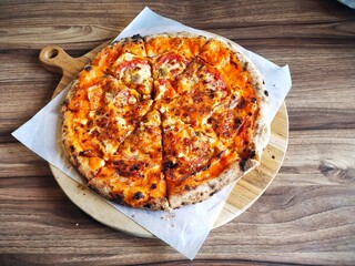 eight slices of Egg and Cheese pizza, homemade recipe on wooden table	