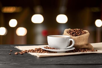Tasty hot coffee in white cup on table